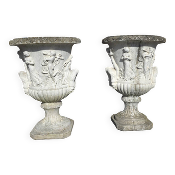 Medical vases with characters in reconstituted stone.