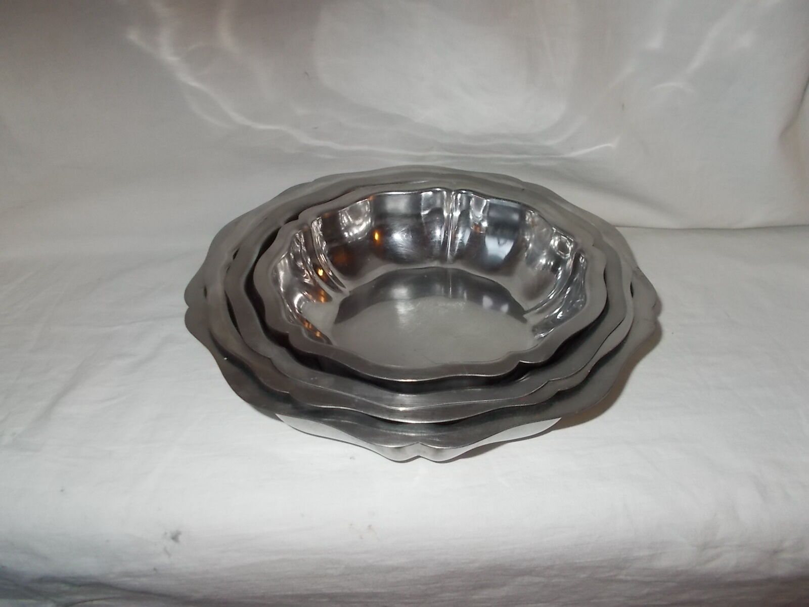 Lot of 4 round hollow stainless steel dishes