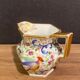 Pot à lait en porcelaine Vieux Paris à décor floral à l'oiseau polychrome et or