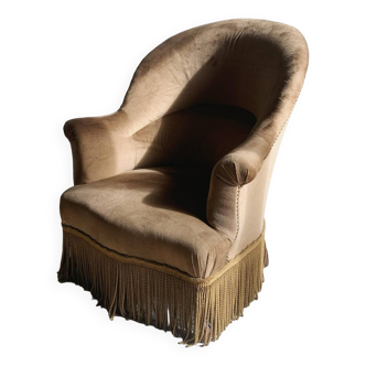 Fauteuil crapaud en velour à franges