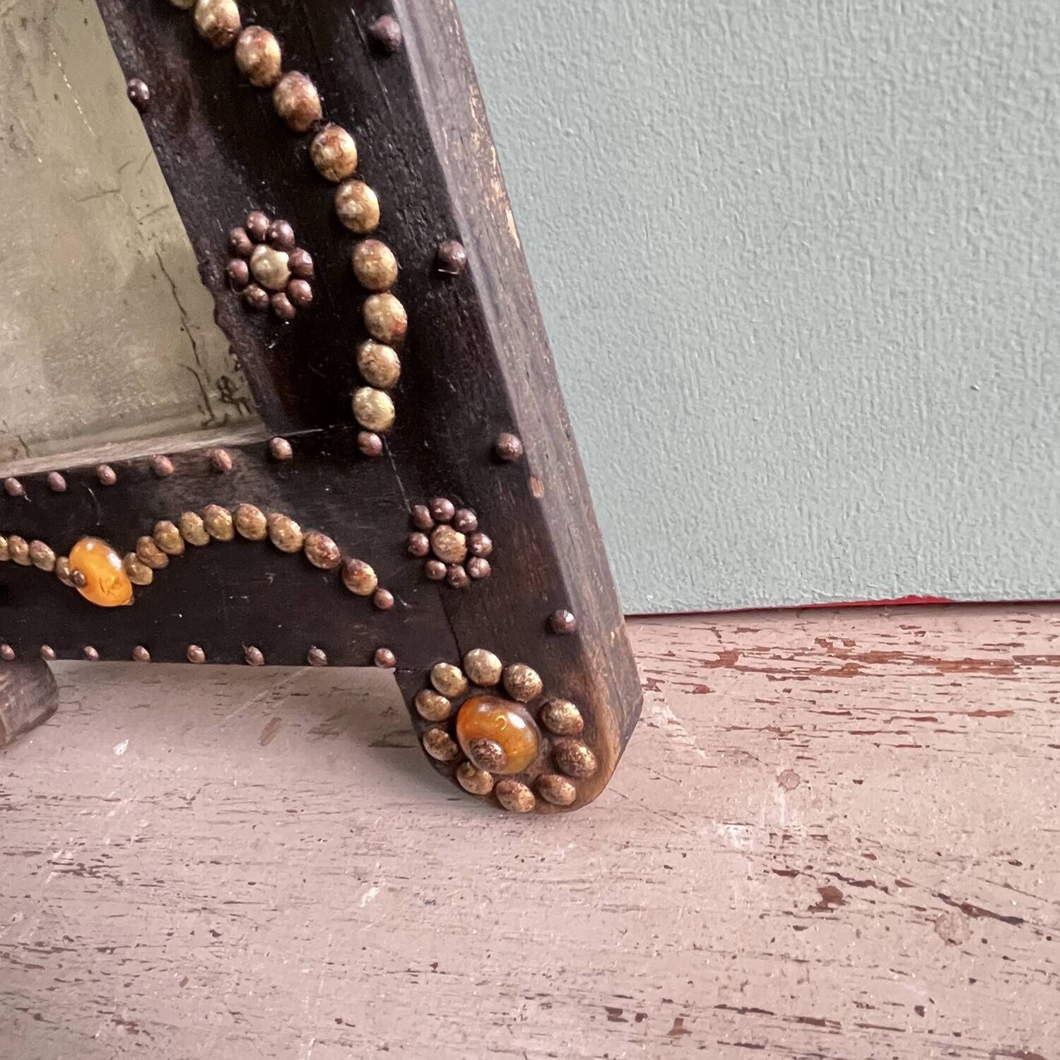 Antique wooden studded mirror