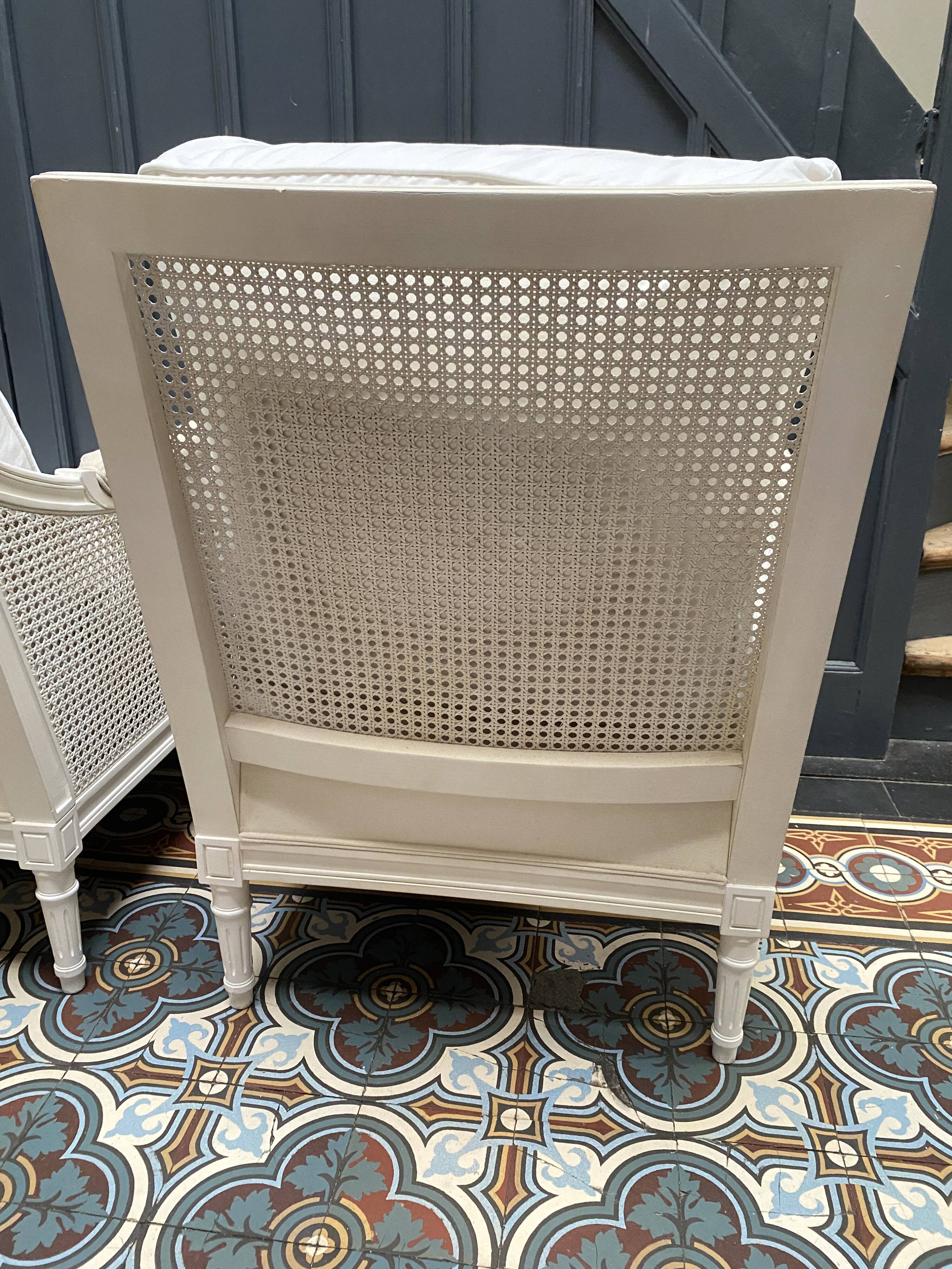 Pair of Louis XVI style caned Bergère armchairs