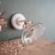 Porcelain and holophane wall light