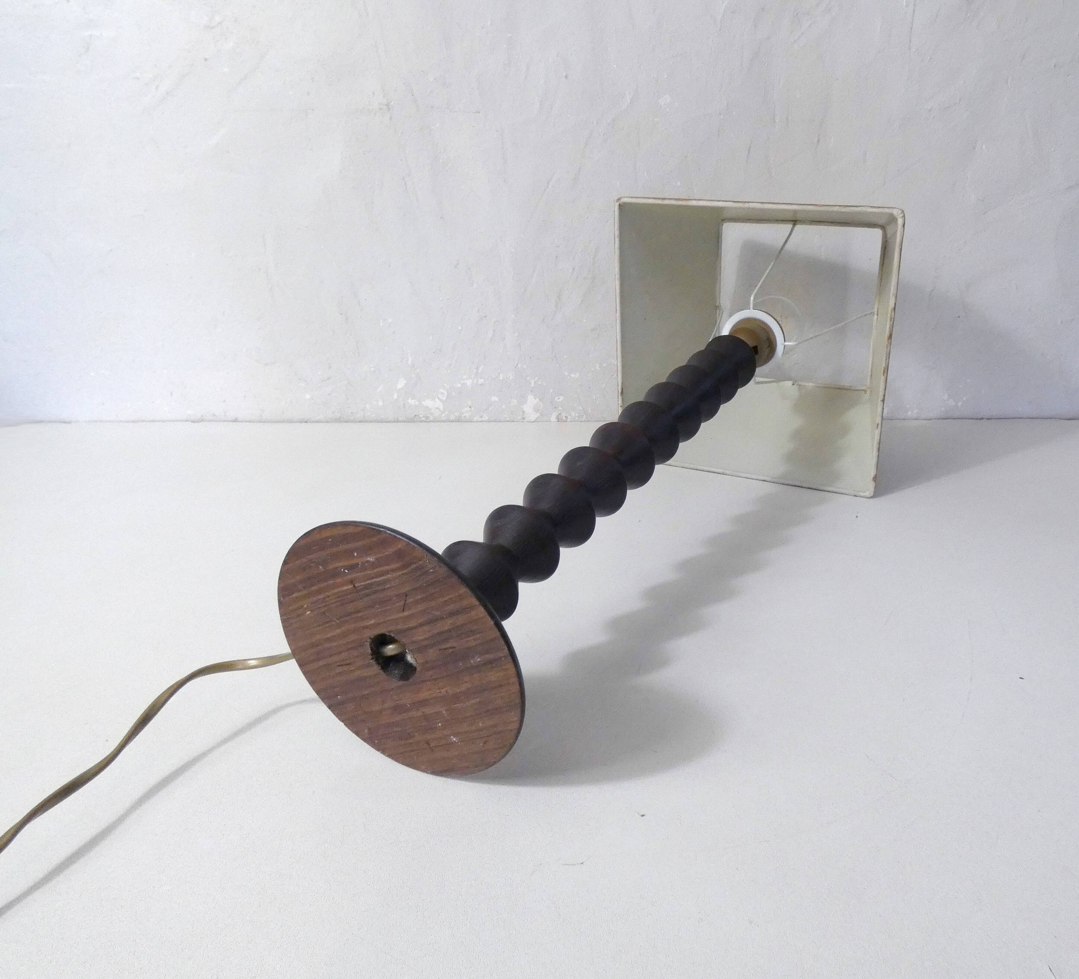 turned wooden lamp with spool base and vintage copper shade