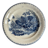 Plat rond en terre de fer à décor d'oiseaux