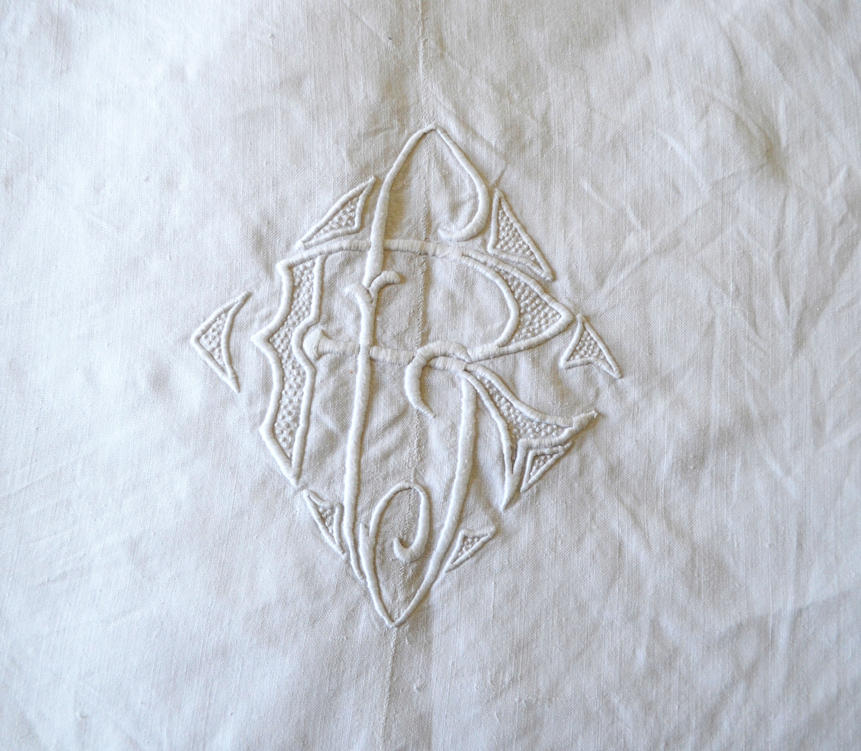 White sheet in monogrammed linen