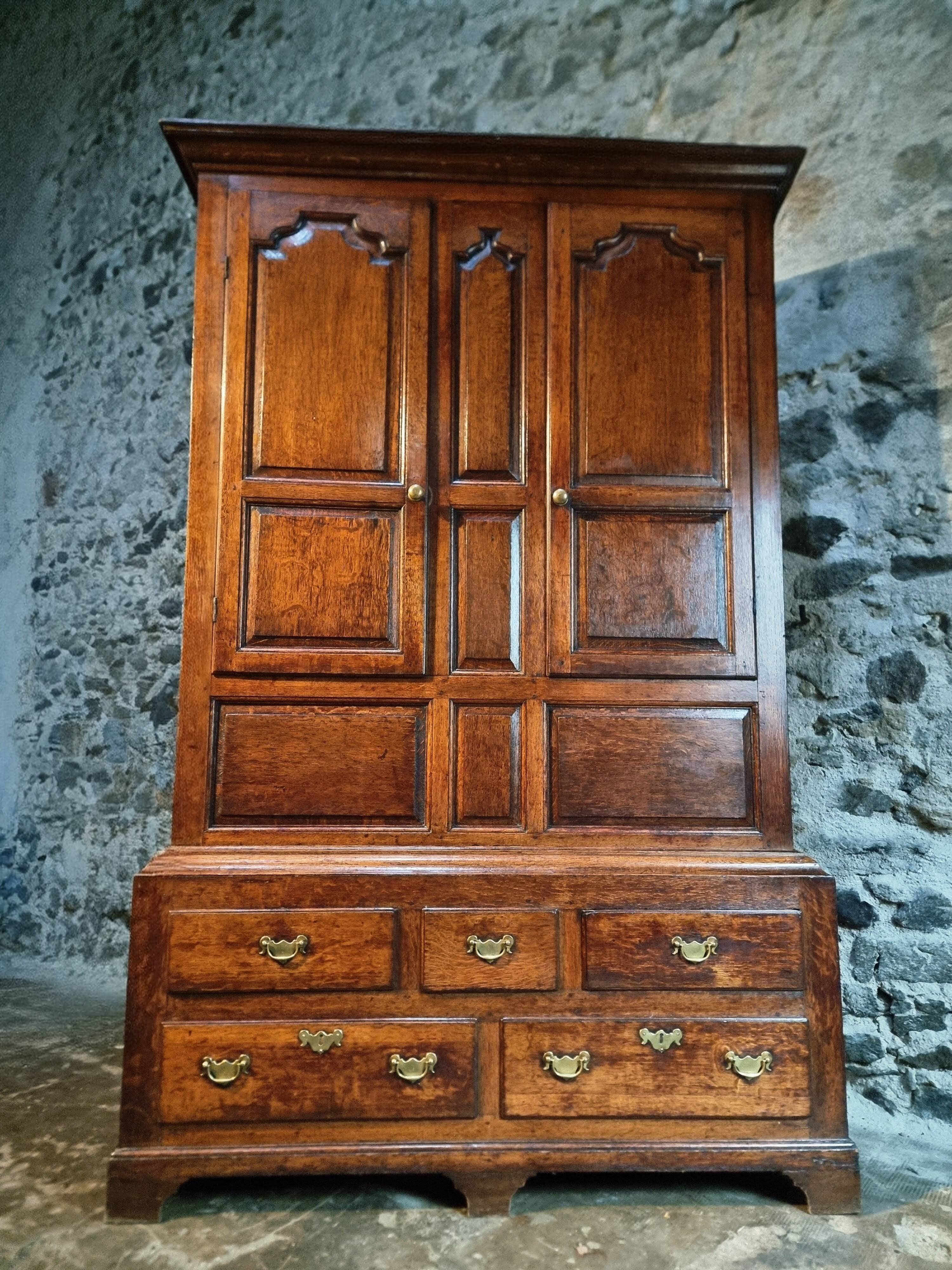 Antique English oak wardrobe with drawers, England, circa 1800–1820.