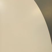 Vintage Eames round table for Vitra in white melamine, wood, and metal.