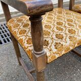 2 Henri II armchairs in solid wood and yellow-beige velvet.