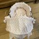 1960s wicker cradle with mattress and drapes.