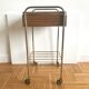 Serving bedside in gold metal and formica