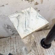 Set of 4 marble columns or pedestals.