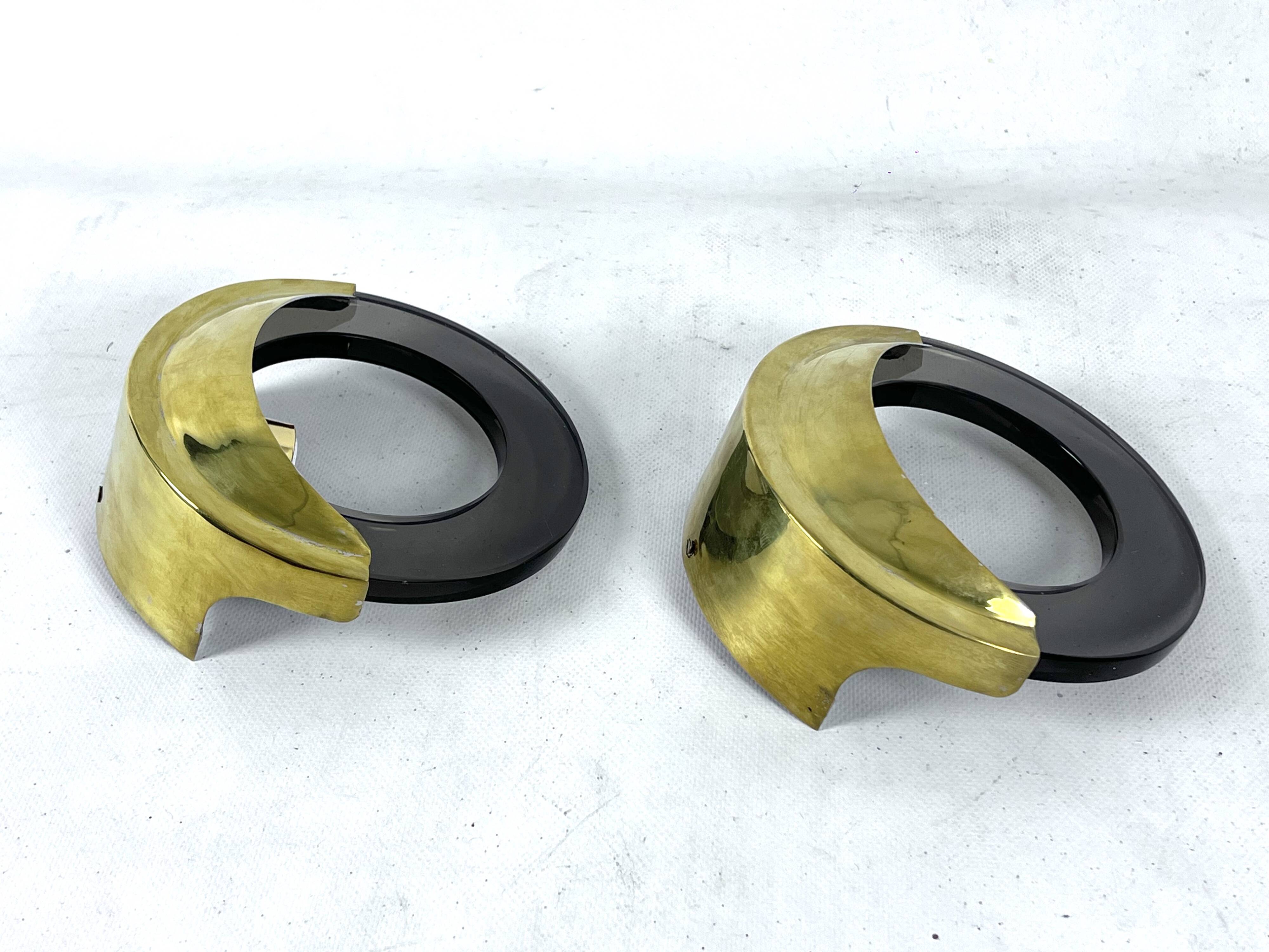 Mid-Century Modern pair of brass and thick smoked glass sconces. Italy 1970s