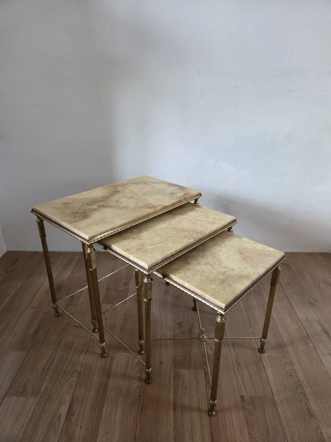 Nested tables in brass and marble, 1950.