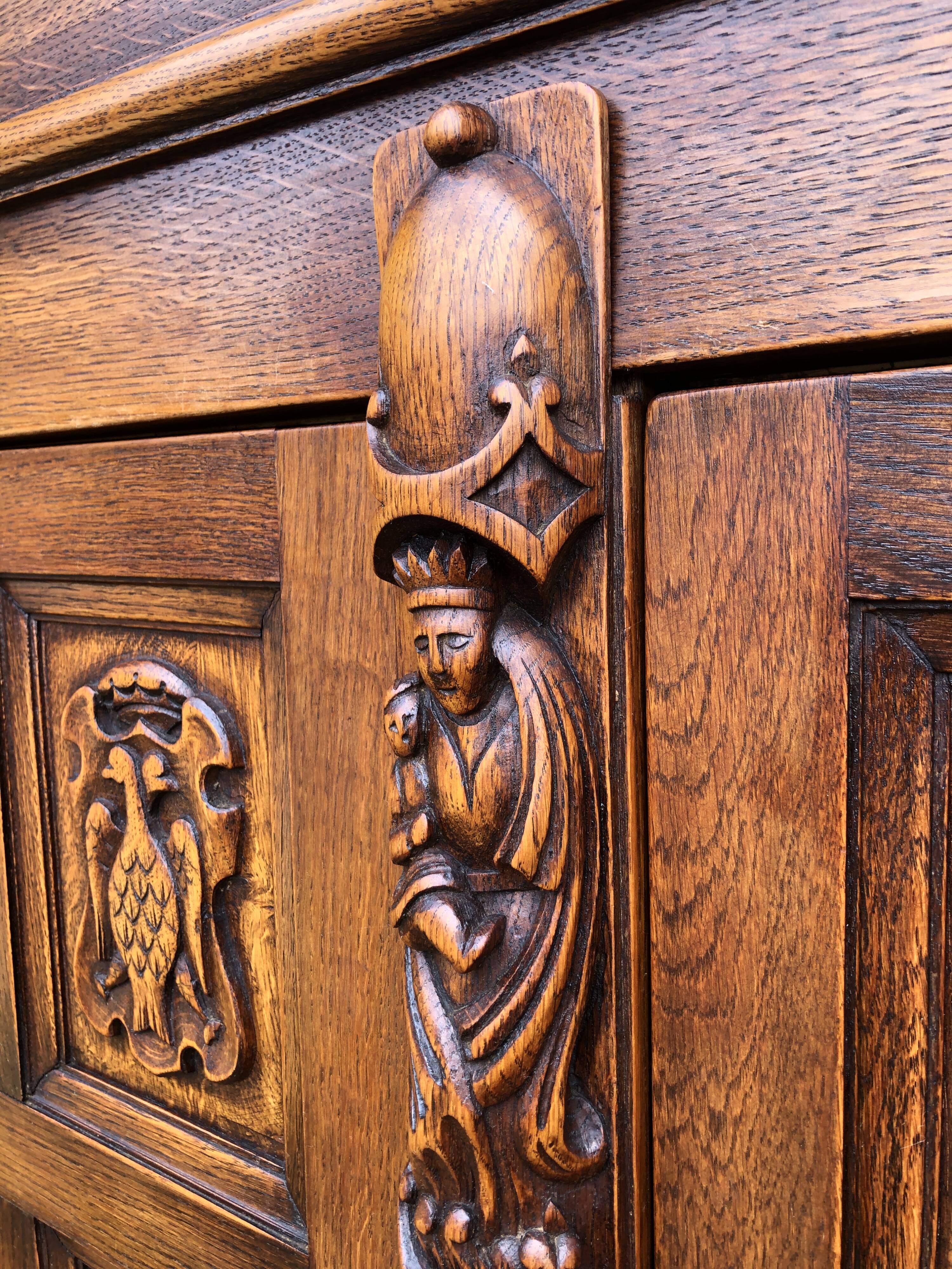 Spanish furniture with carved wood profiles and coats of arms from the 1950s.