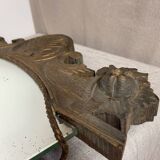 Antique wooden mirror with an unusual shape