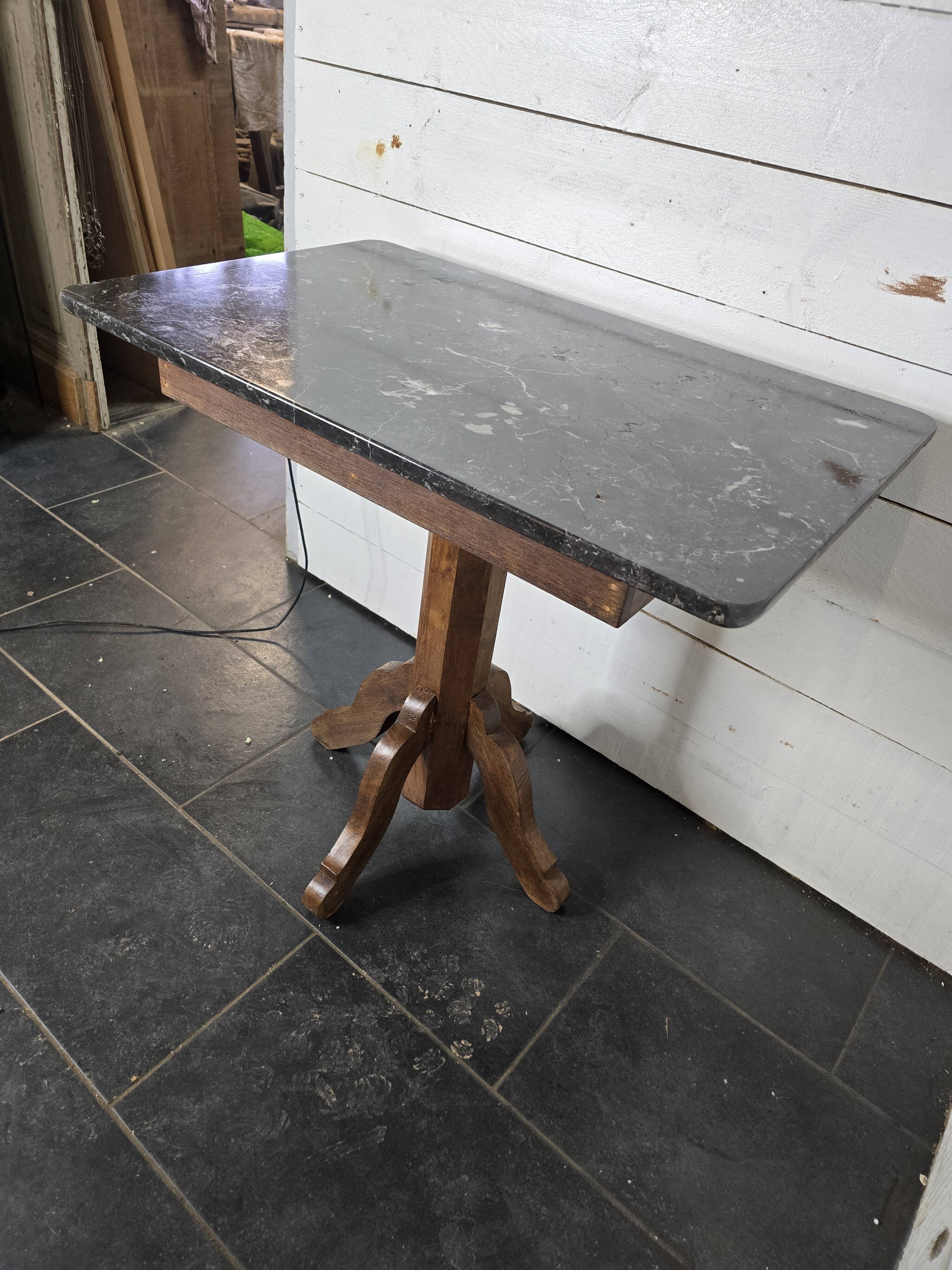 Old pedestal table with oak legs and marble top