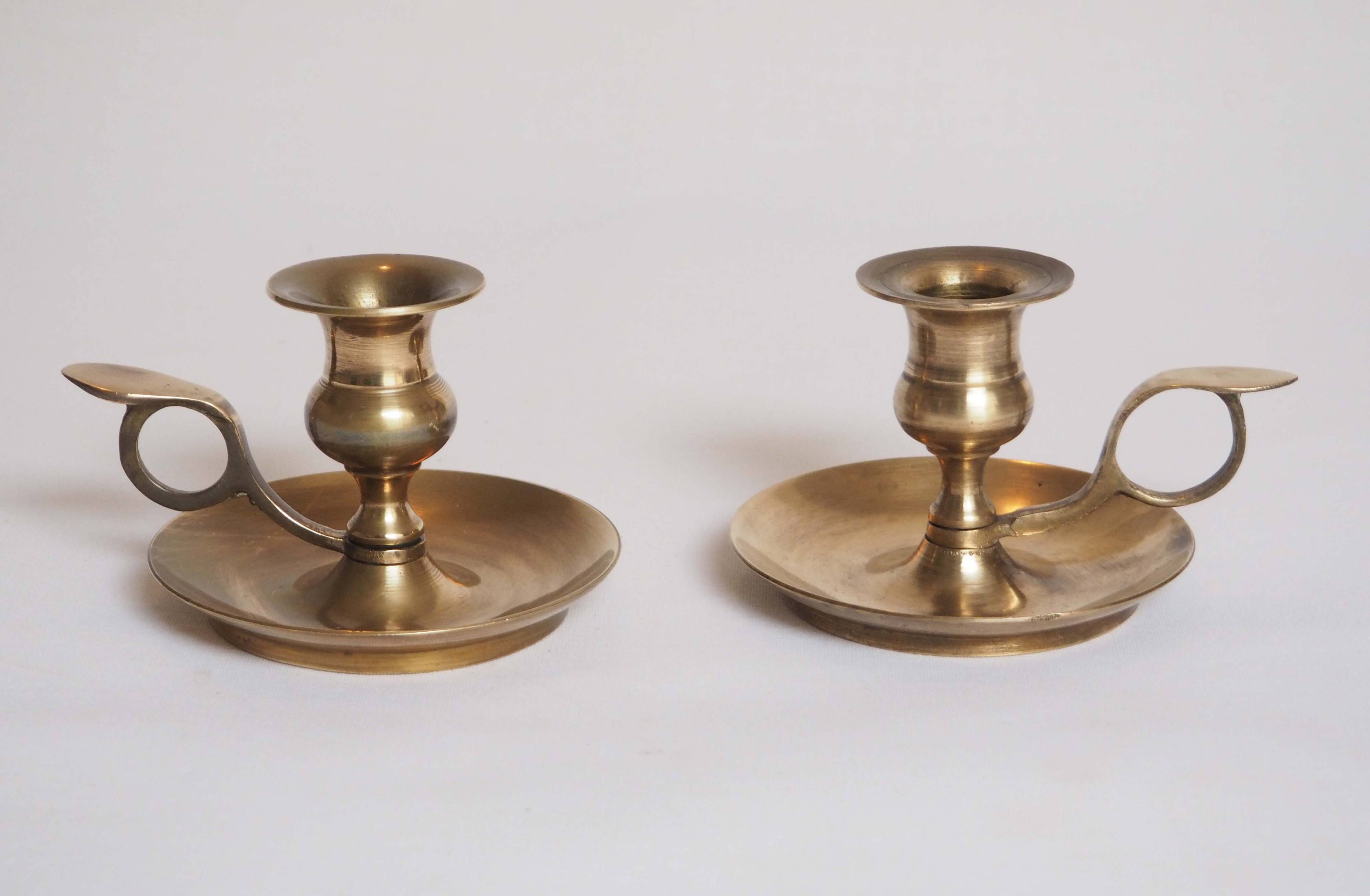 Brass candle holder with cup and handle