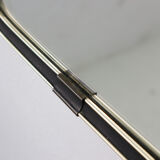 '50s wall mirror with relief brass frame