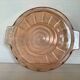 Pink glass plate with handles in Rosaline style.