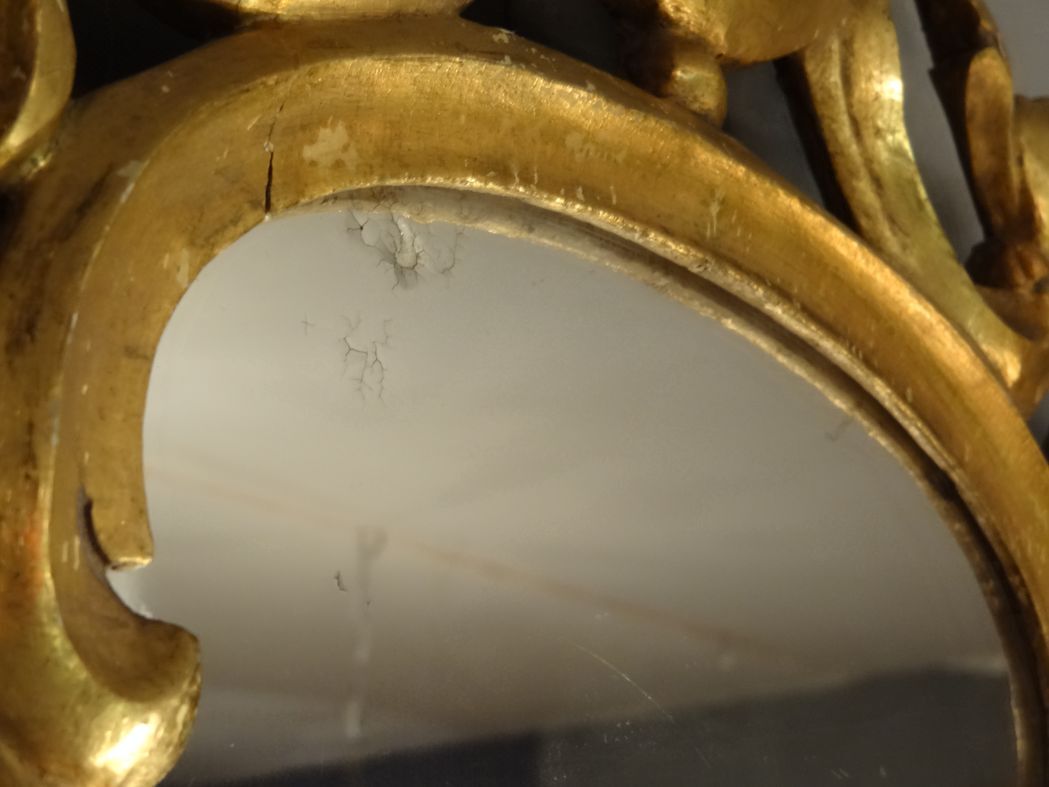 Carved and gilded wooden mirror with gold leaf 46 x 103 cm