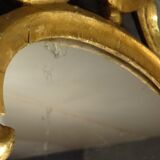Carved and gilded wooden mirror with gold leaf 46 x 103 cm