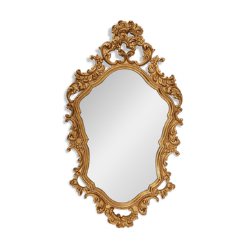 French Rococo or Baroque style facet-cut crest mirror in gilded carved wood