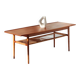 Vintage Scandinavian coffee table in teak and rattan – Danish design from the 1960s.