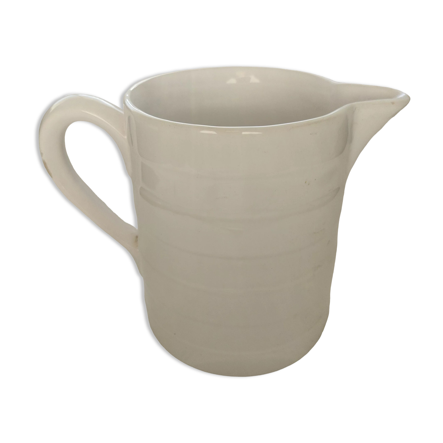 Antique white ceramic pitcher