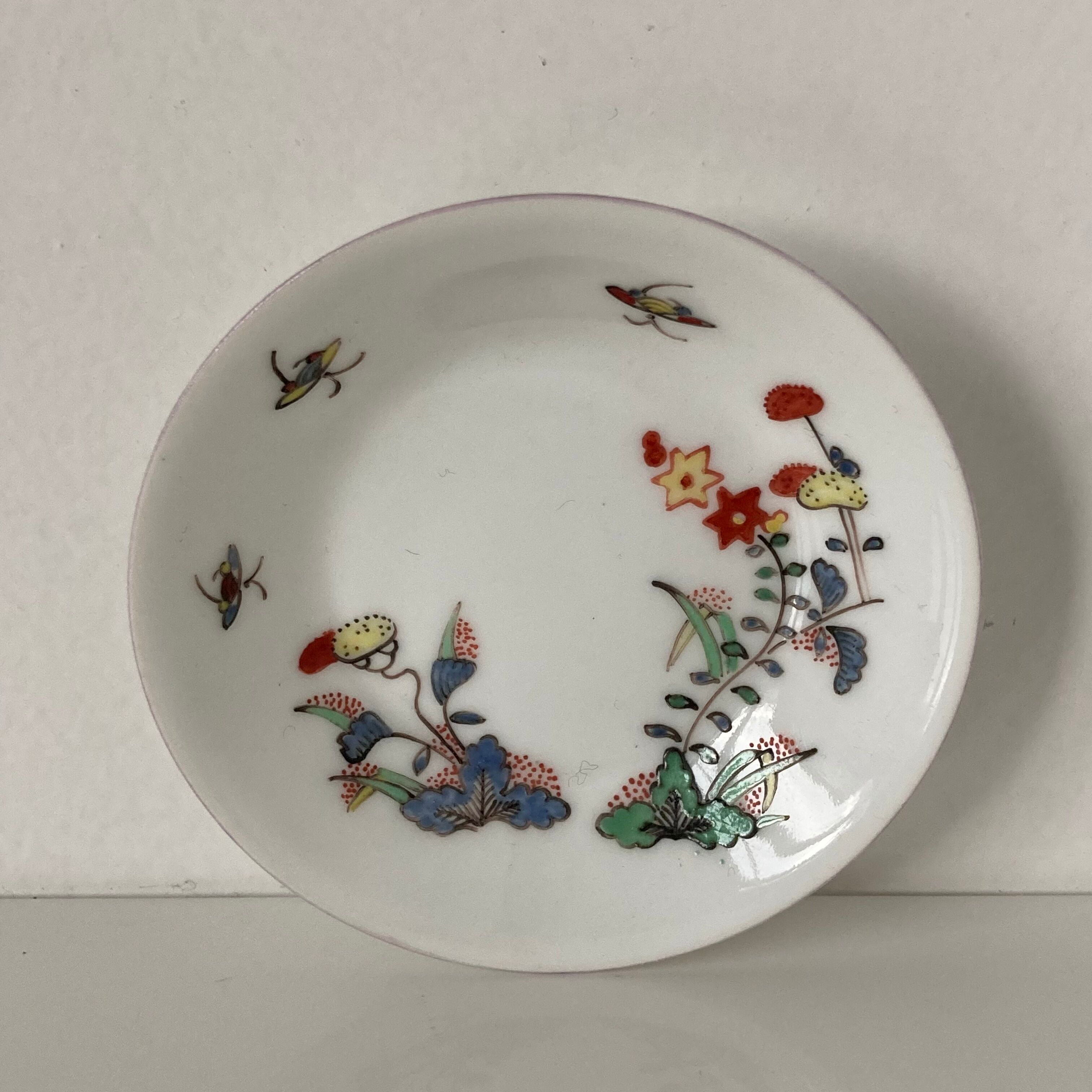 Limoges porcelain cup and sub-cup decorated in Chantilly in the Japanese Kakiemon style