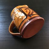 Hand decorated terracotta pitcher