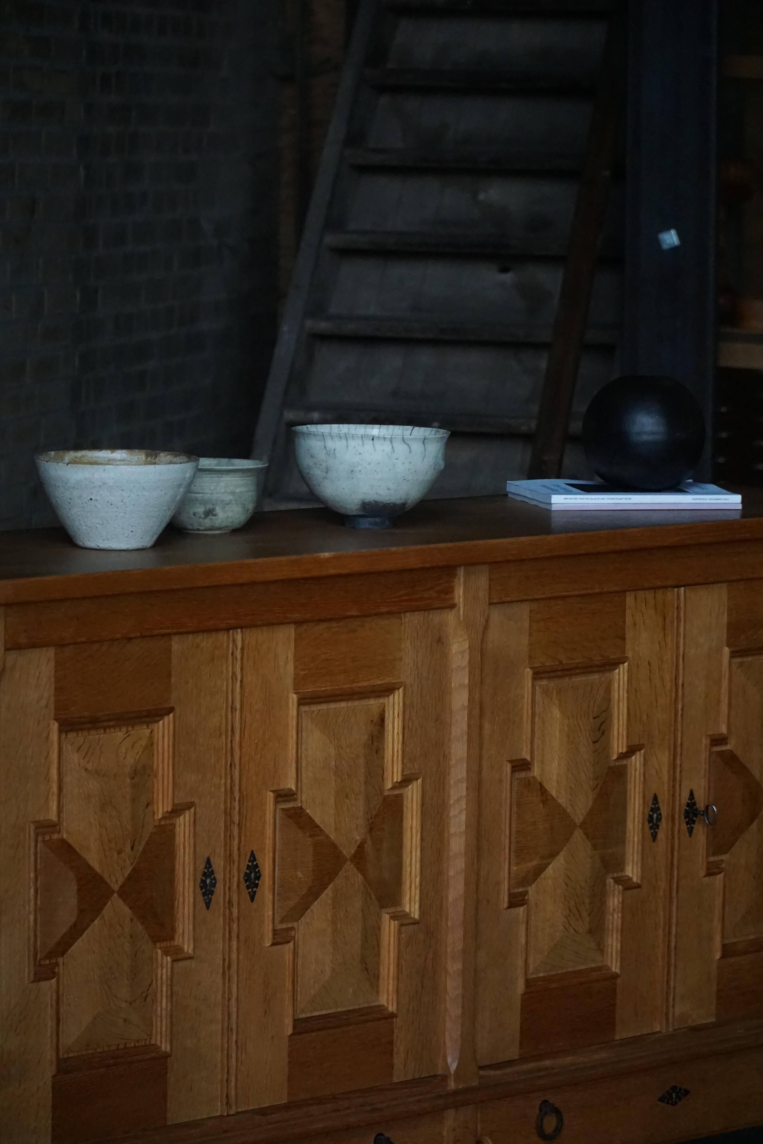 Henning Kjærnulf, enfilade in oak, mid-century Danish, Nyrup Møbelfabrik, 1960s.