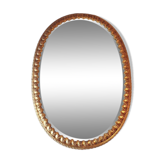 Golden mirror decorated with water leaves and palmettes