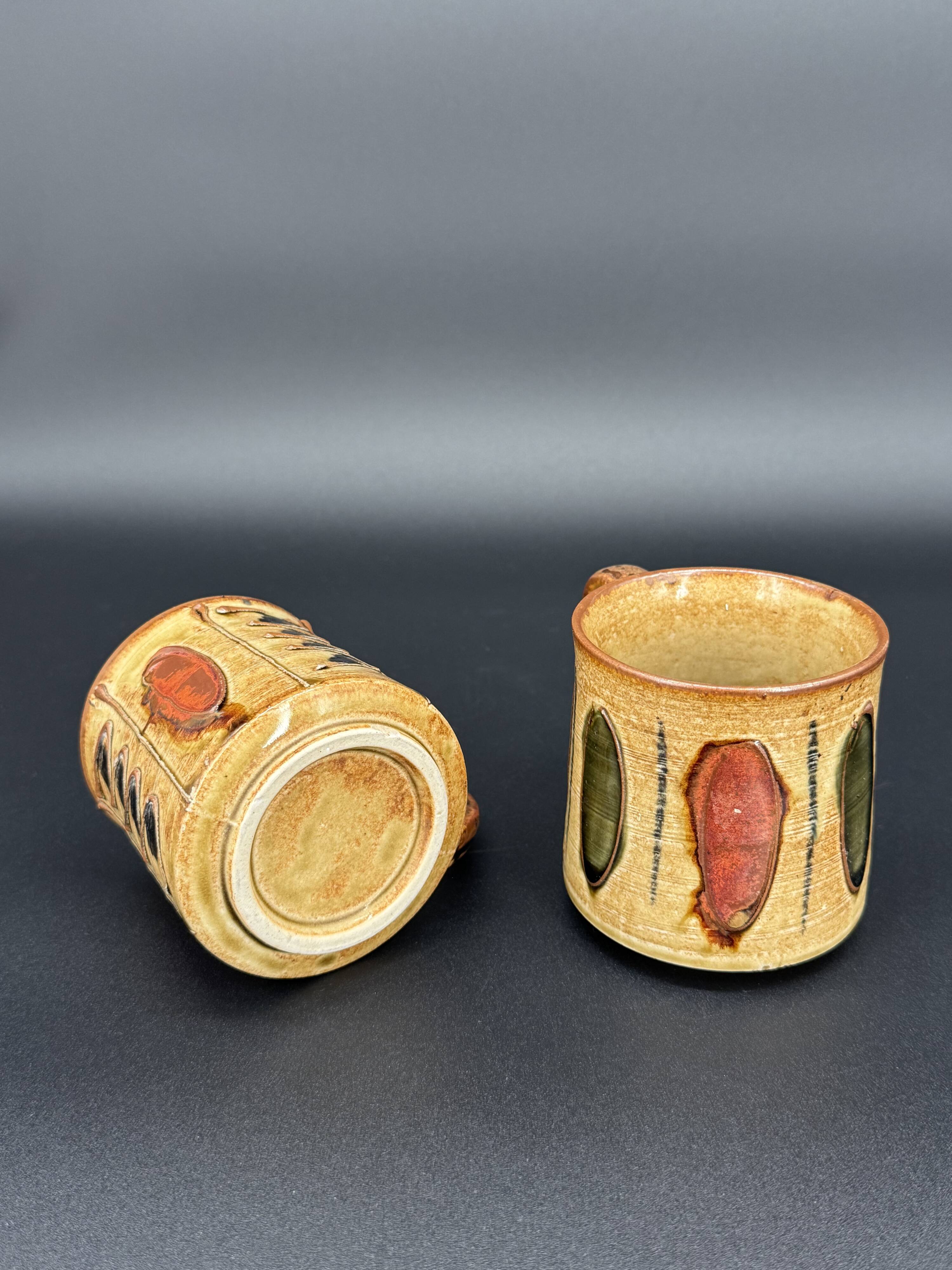 Pair of glazed stoneware mugs — abstract decor from the 70s