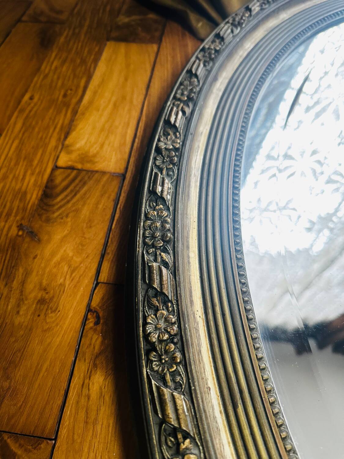 Large antique oval mirror
