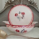 Mismatched old soup plates accompanied by a soup tureen