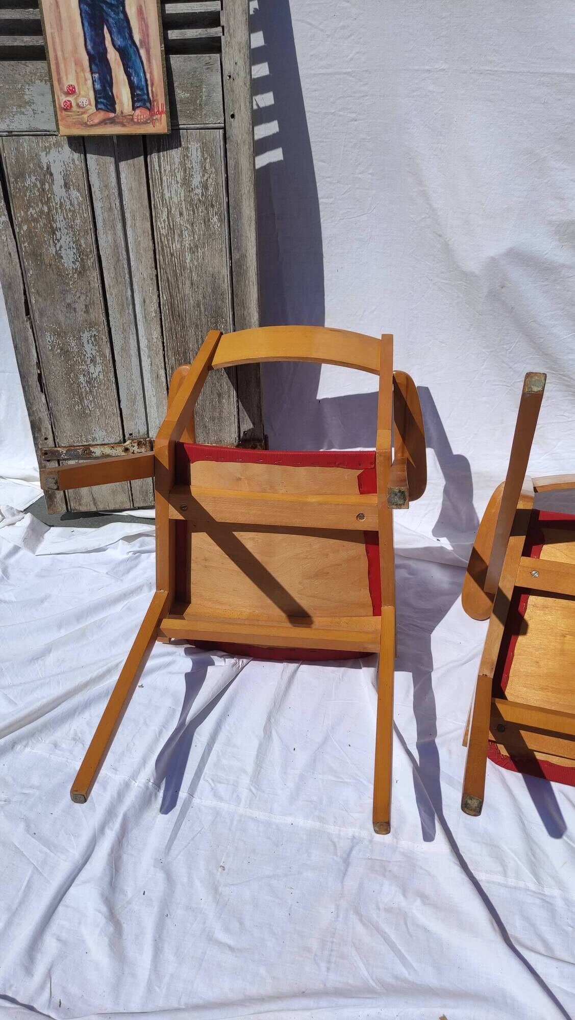 Pair of wooden armchairs and skaï foot compass of the 50s