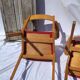 Pair of wooden armchairs and skaï foot compass of the 50s