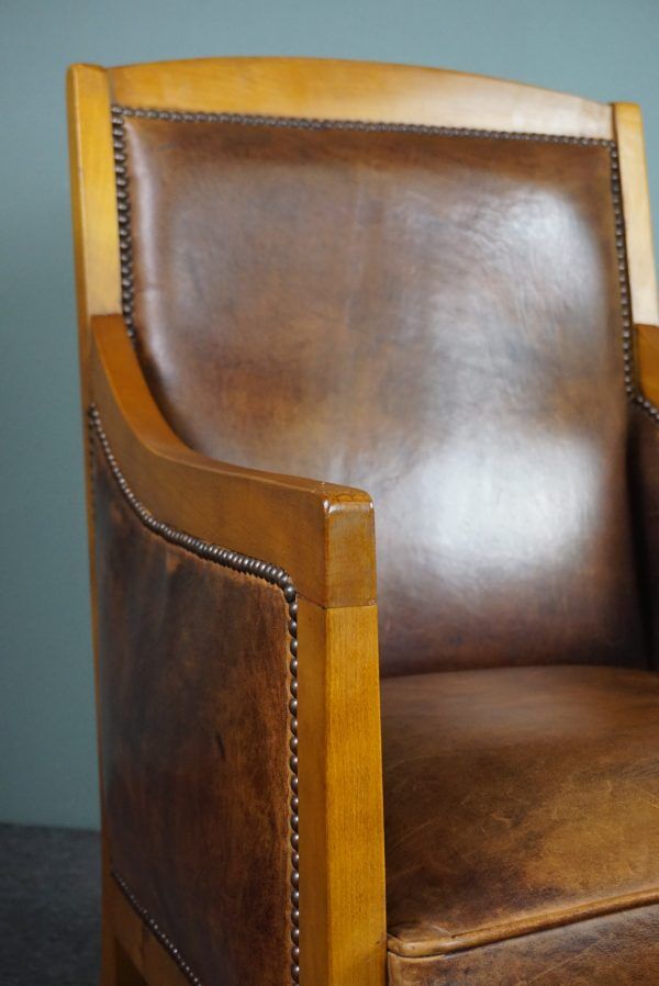 Armchair in sheepskin with beautiful light wood