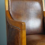 Armchair in sheepskin with beautiful light wood