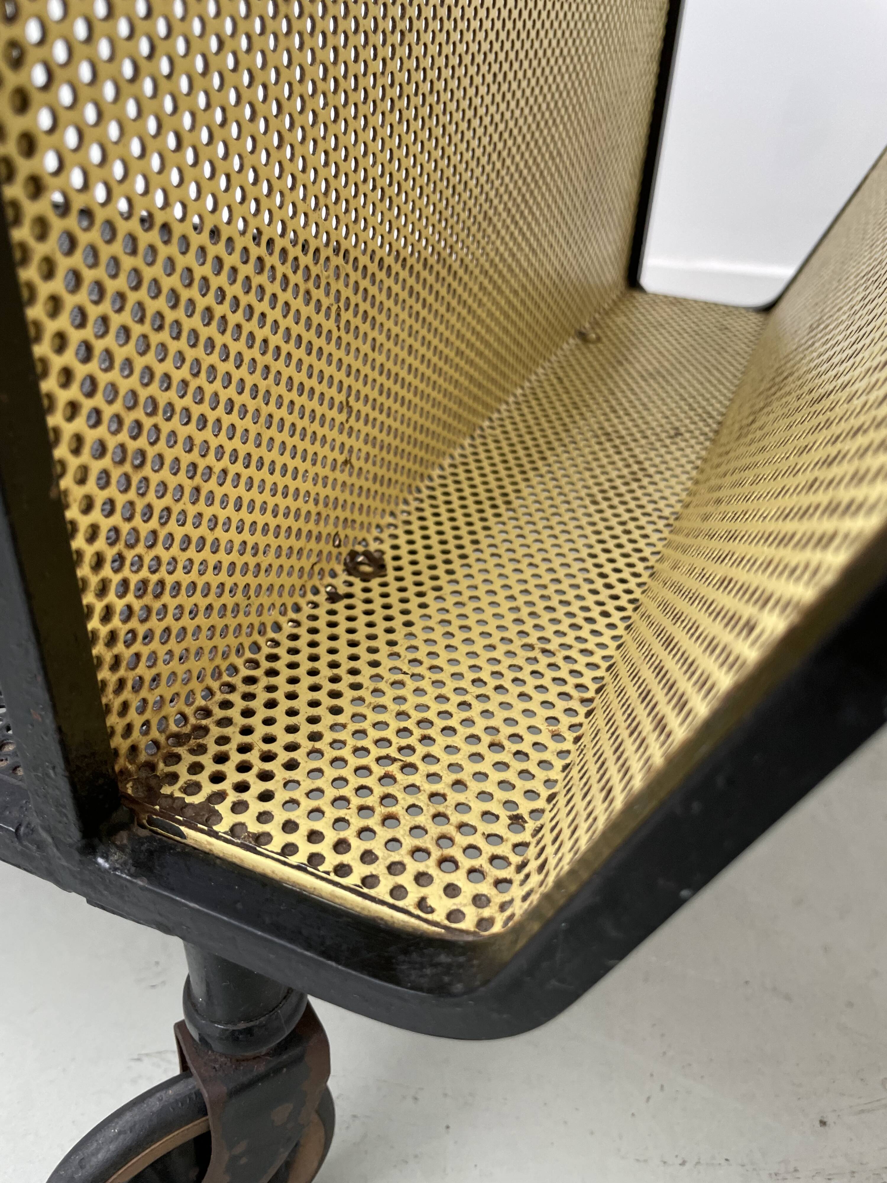 Perforated metal serving trolley in the Mathieu Matégot style