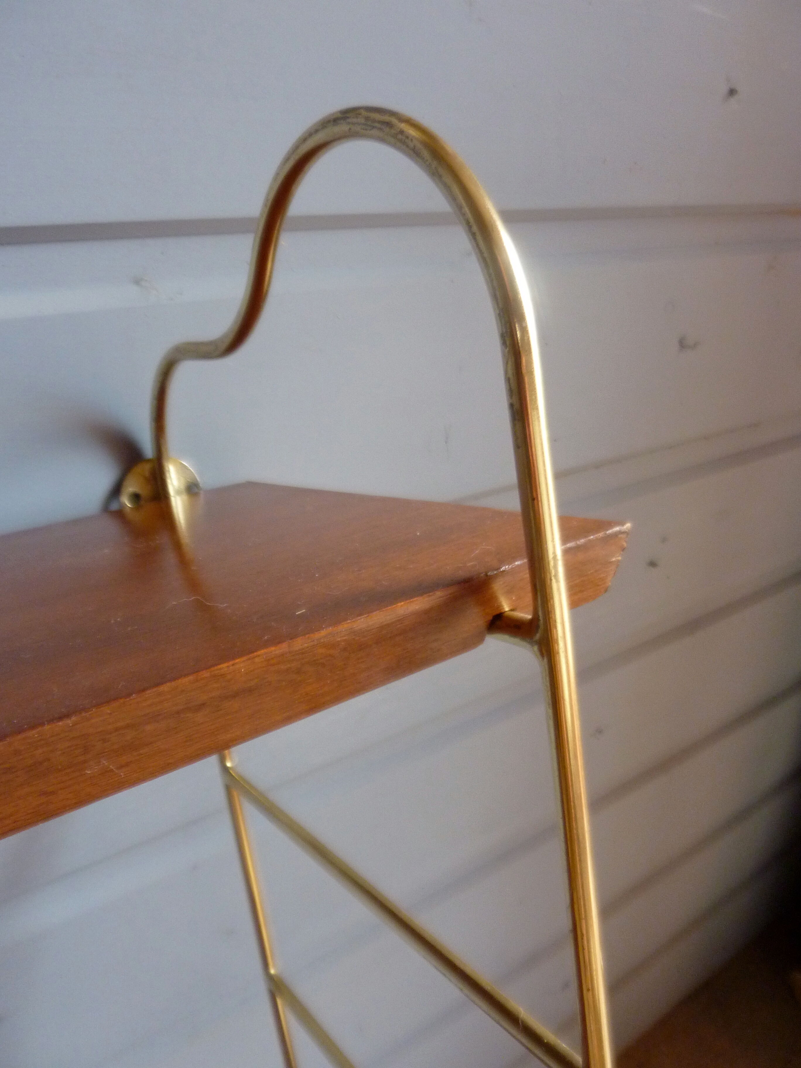Wall shelves in brass and teak of the 1960s