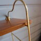 Wall shelves in brass and teak of the 1960s