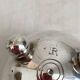 Art Deco tumbler in silver metal with alphabetical decoration