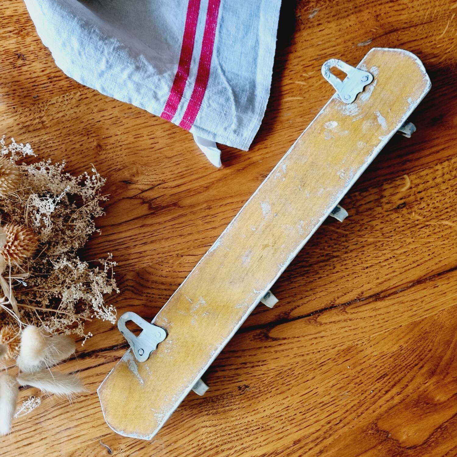 Old coat hook tea towel holder