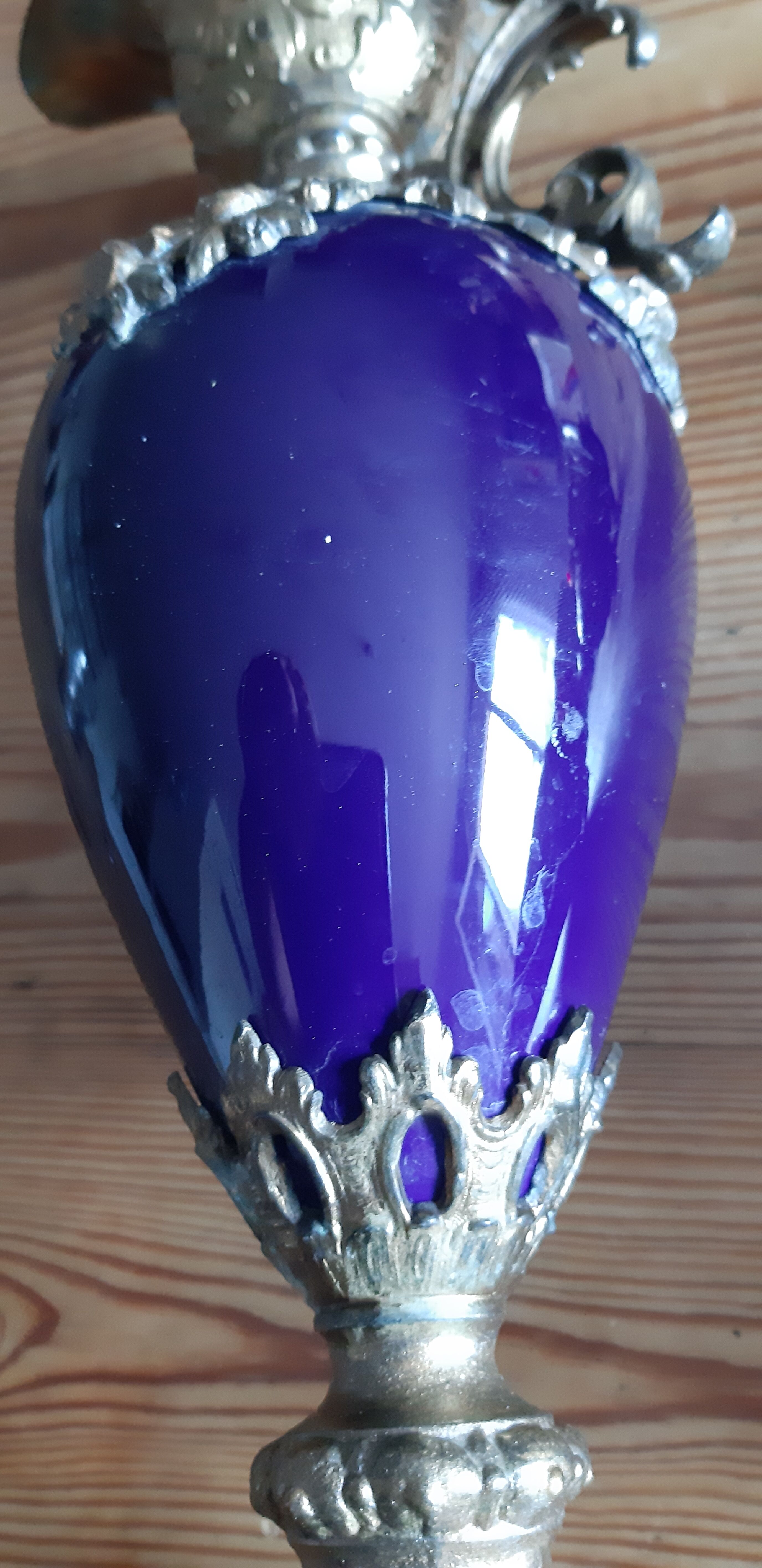 Pair of golden regulated ewers and blue glass