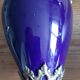 Pair of golden regulated ewers and blue glass