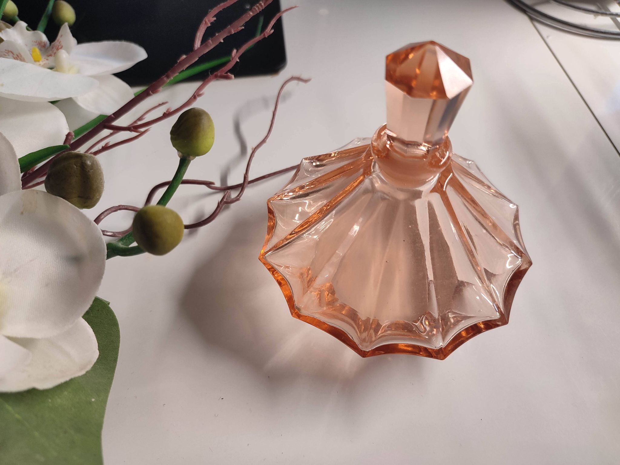 Vintage Art Deco perfume bottle in beautiful pink glass.