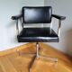 Swivel office chair Strafor with chrome metal and black faux leather.