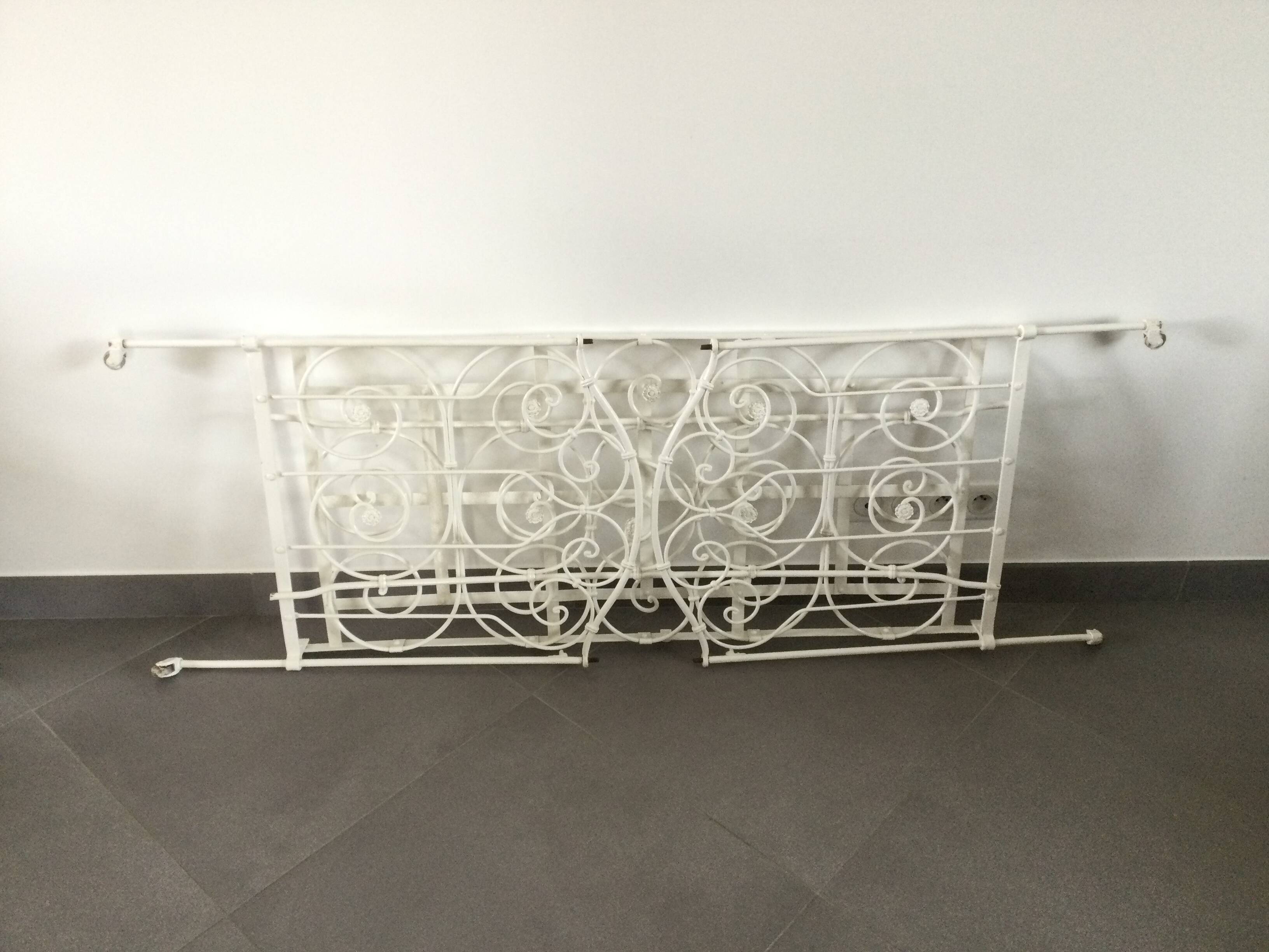 White wrought iron folding bed